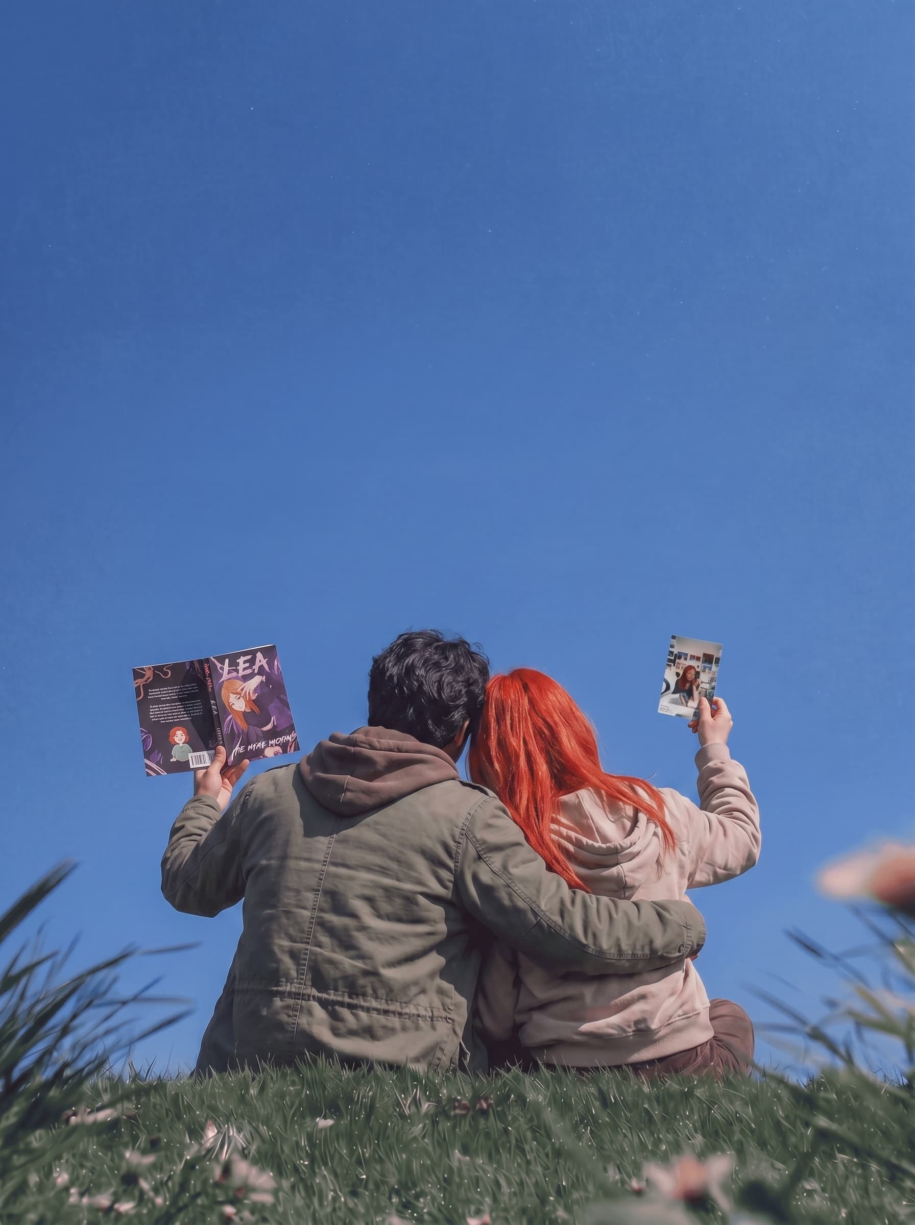 Couple holding their personalized Stanly book and a memory photo
